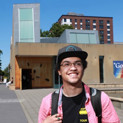 A student in front of Seattle University's Chapel of St. Ignatius