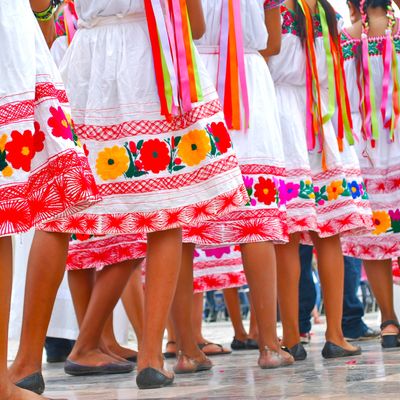 Photo of dancers in colorful dresses