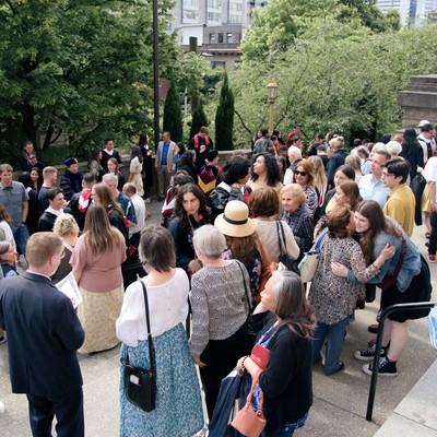 A group of people standing on a staircase.