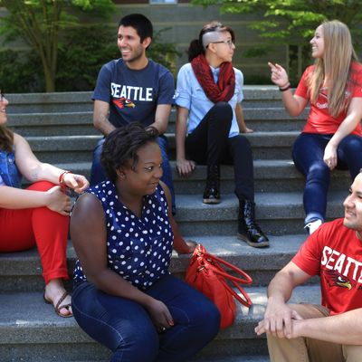 students hanging outside the library