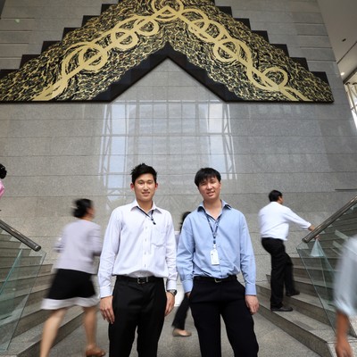 Thai students posting under arch