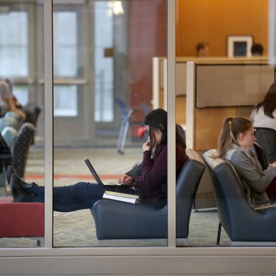 A group of people sitting in chairs.