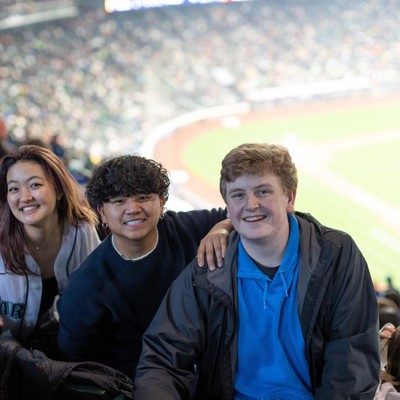 A group of people sitting in a stadium.