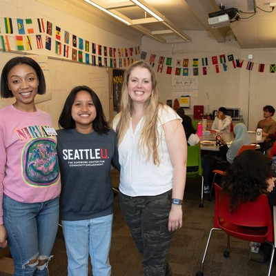 A group of people standing in a room.