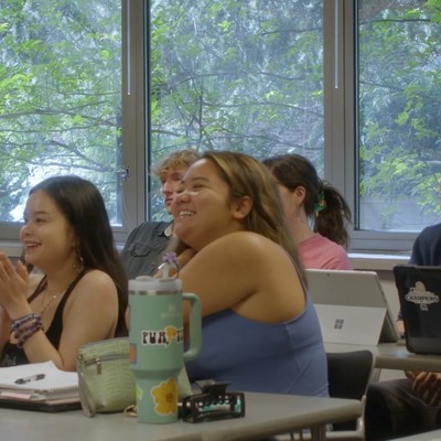 students laughing in a classroom