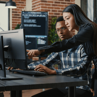 woman and man discussing issue over computer