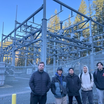 Students standing in front of substation