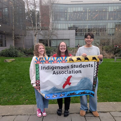 ISA officers holding the group banner.