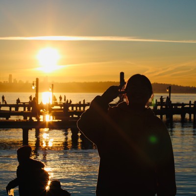 a person watches a sunset