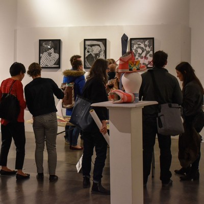People Enjoying Art at a Gallery