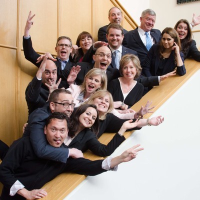 A group of people striking funny poses on a staircase