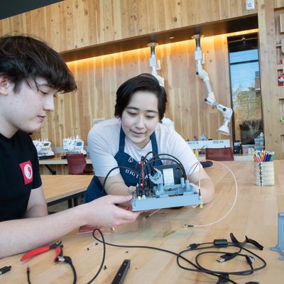 Student works with electrical equipment in makerspace