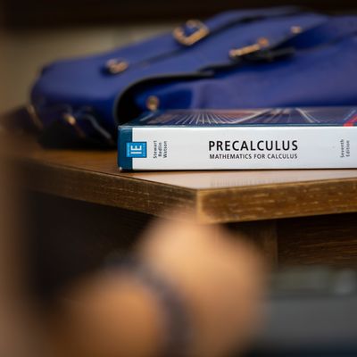 Precalculus textbook on desk