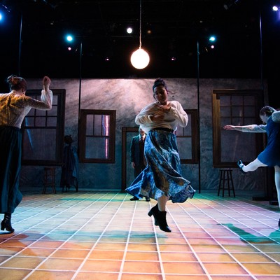 Actors dance onstage