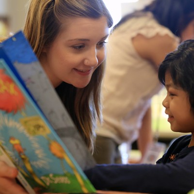 Student helps a child read
