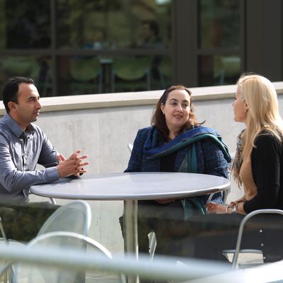 A group of people sitting at a table.