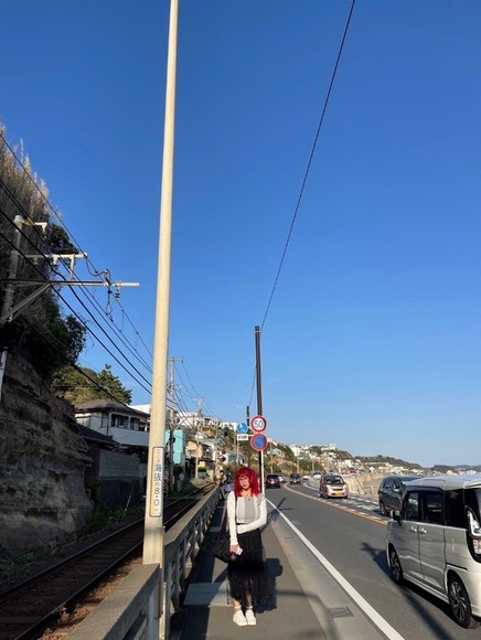 Woman standing on the streets of rural Japanese street