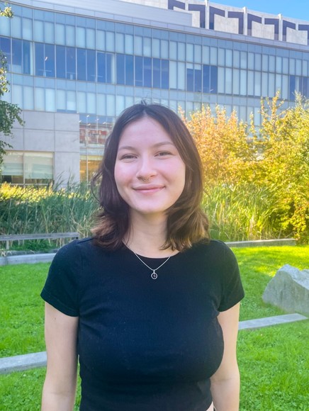 Photo of Julia Dentone in front of the library