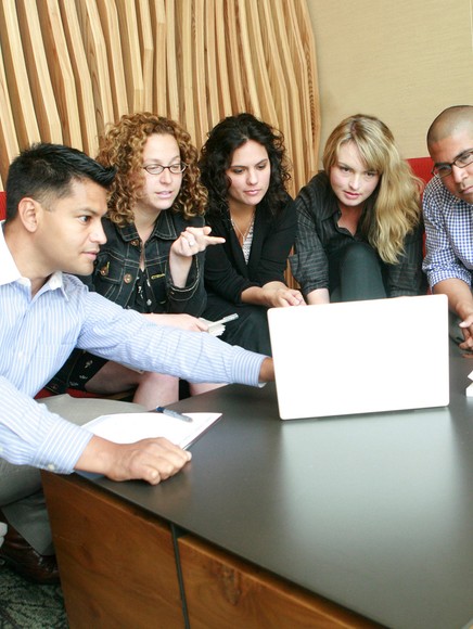 College students sharing a table and collaborating