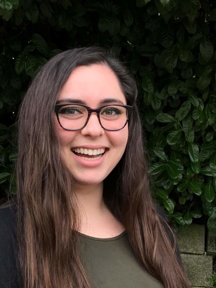 A woman smiling at camera.