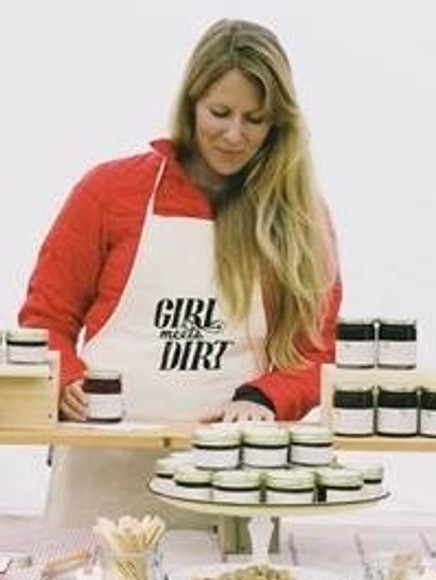 Audra Lawlor wearing apron with food from her business