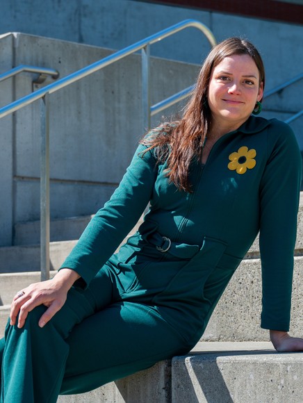 Maria Gotay smiling sitting on campus