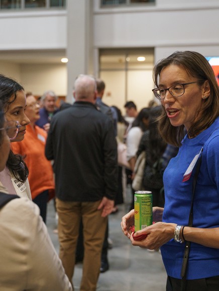 Mentor and students talking at the Mentor Fair reception