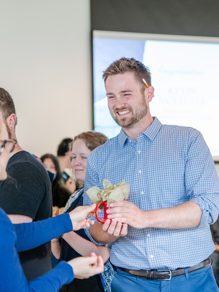 MIT Student Smiling Receiving Gift at Teaching for Equity Showcase