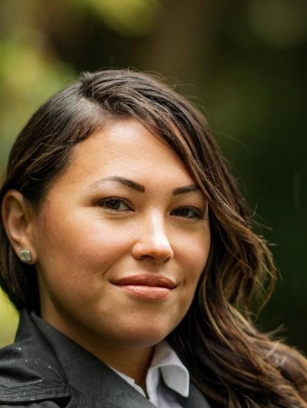 Photo of Toshiko Hasegawa in front of tree