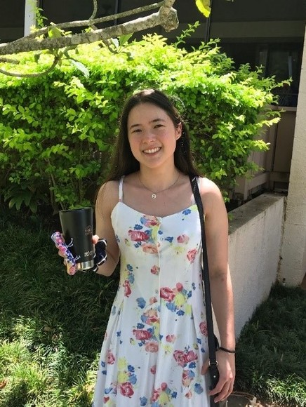 Photo of Elena Pendleton in front of greenery