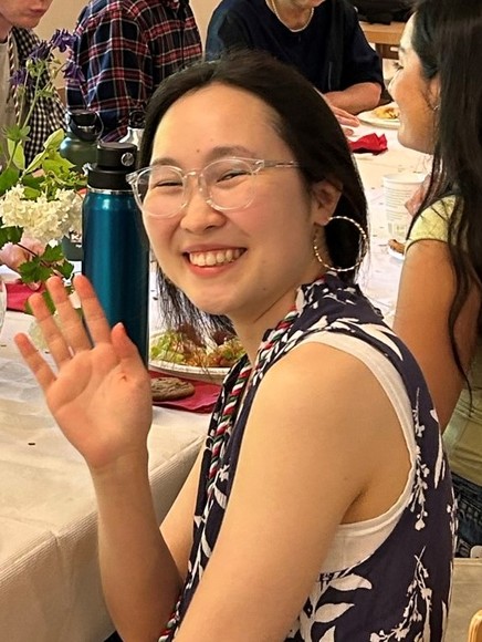 Photo of Michelle Nurzhanov waving at photographer