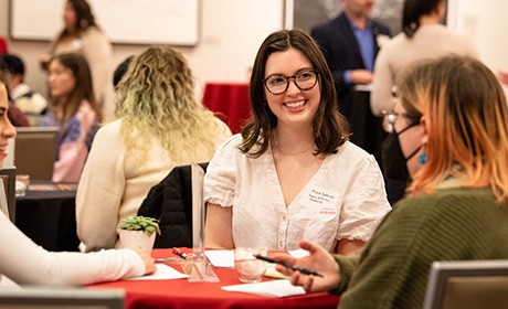 Three women at an alumni event