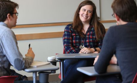 A group of graduate students in a small group class