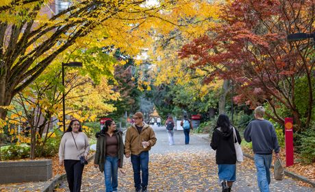 Fall colors on campus with students walking