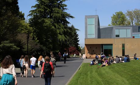 Students walk in front of chapel