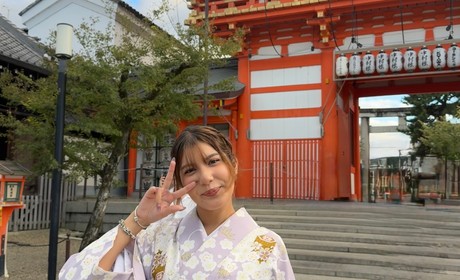 woman in kimono posing in front of Japanese temple