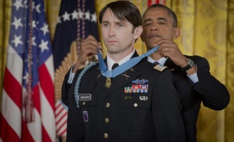 President Obama giving an SU veteran student the medal of honor