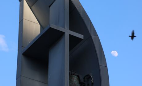 Image of Seattle University bell tower located across the Reflection Pool from the Chapel of St. Ignatius.