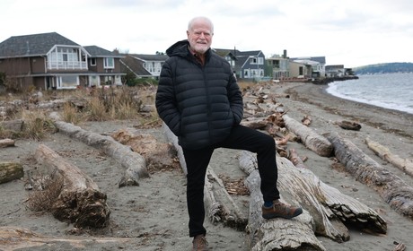 Robb Petersen standing on a beach