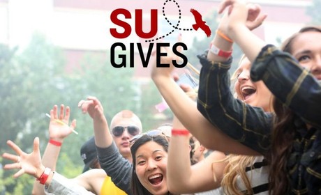 Students cheering with SU gives logo overlay