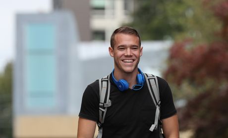 student walks in front of chapel