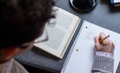 A student writing notes