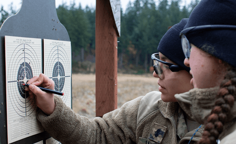 Cadet showing target to another cadet