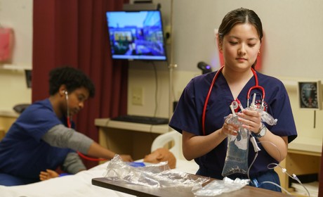 Two students practice skills