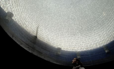 Woman under a glass mosaic dome