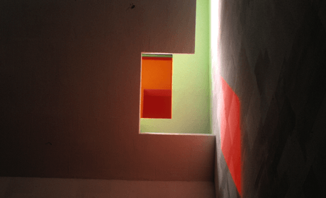 Image of colorful light filtered through a stained glass window