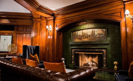 A photo of a fireplace and seating inside Hotel Sorrento