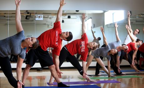 People doing yoga in recreational room