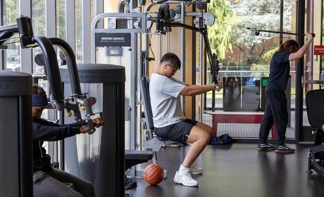 People using the weight machines in the rec center