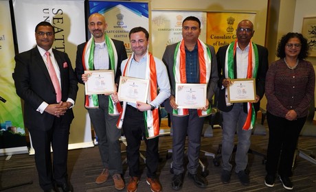 Speakers pose after event